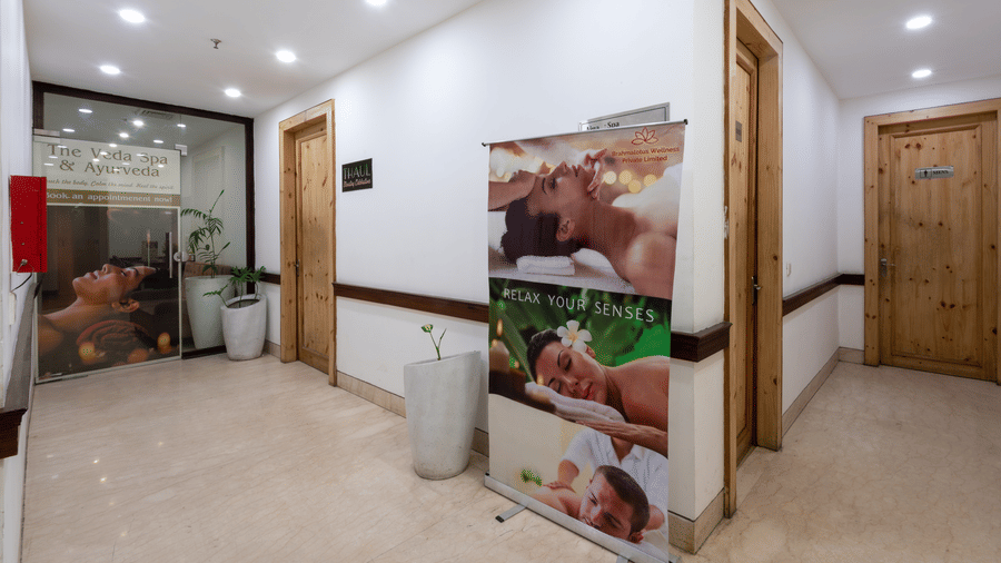 entrance of the spa with a banner featuring treatments at DLS The Classio